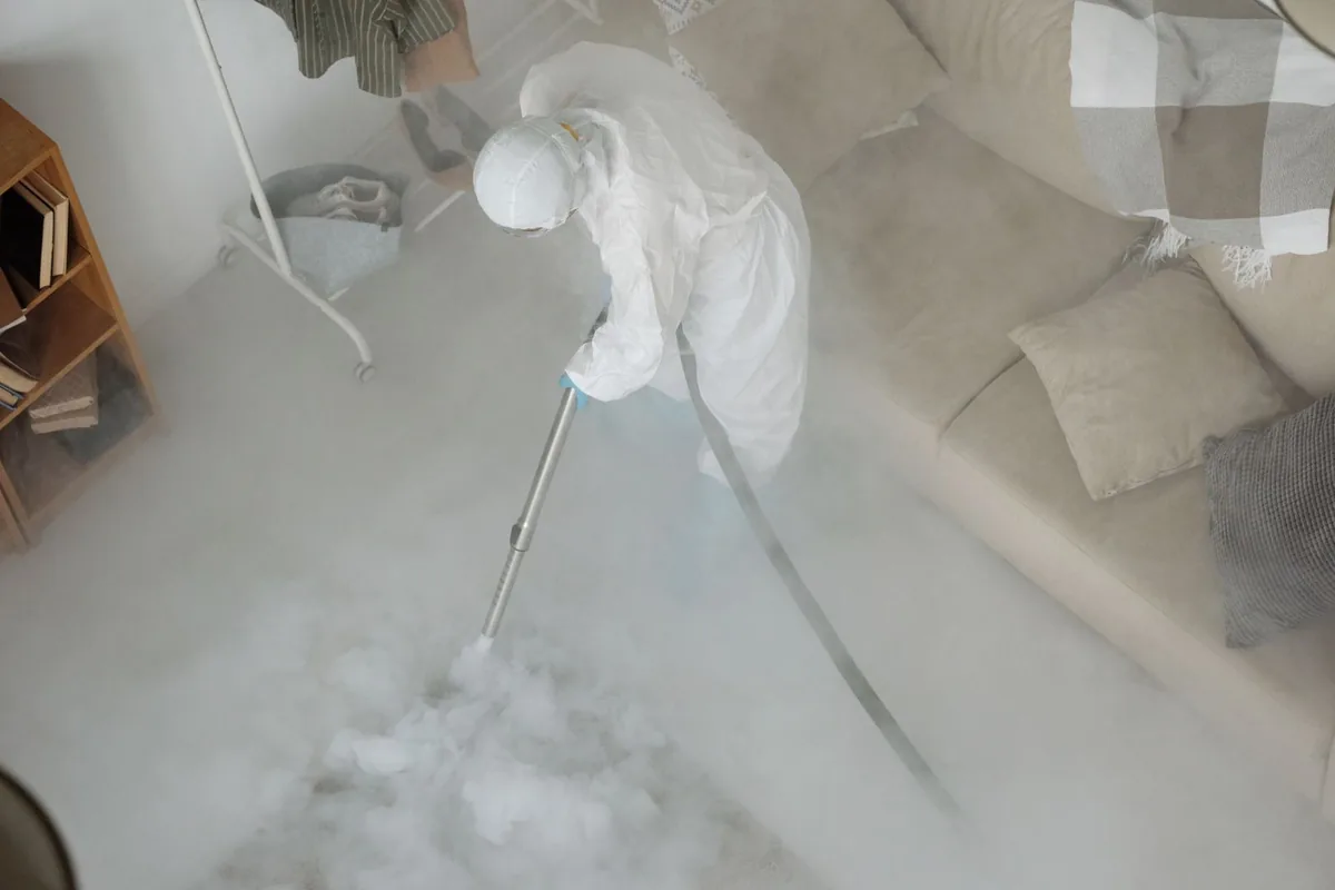 Biohazard cleanup technician in protective equipment, Mansfield Center, MA